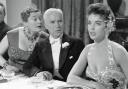 Dawn Addams (foreground right) in A King in New York with a perplexed Charlie Chaplin and Joan Ingram.  Photo: Movie Stills Database/moviestillsdb.com