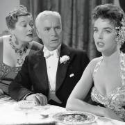 Dawn Addams (foreground right) in A King in New York with a perplexed Charlie Chaplin and Joan Ingram.  Photo: Movie Stills Database/moviestillsdb.com