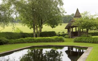 Lush greens by the pavilion at Colemore House