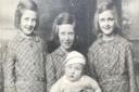 Brian as a baby with his three youngest sisters