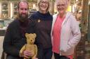 Julie Tatchell and Amanda Middleditch on the set of The Repair Shop with bear owner John McMuldoch credit BBC/Ricochet