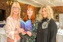 Author Sheryl Browne reading her latest book 'The Marriage Trap with Sue France organiser of the event and Author Amanda Prowse