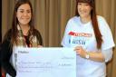 Lindsay hands over the cheque to Sabina