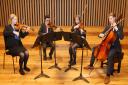 6th form string quartet students in The Stoller Hall at Chetham's School of Music