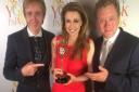 Emma Samms with Jon Culshaw, lead actor in Visitors, and composer Richard T Holmes who wrote an original score for the play, at the awards ceremony in New York City
