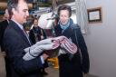 David Collinge, chairman of John Spencer Textiles presenting a gifted woven throw to HRH Princess Royal
