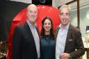 Rodney Banks Lyon, Maxine Banks Lyon, co-founder of Bremont Giles English in front of the bonnet of an e-type Jaguar