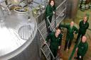 Hawkshead Head Brewer Matt Clarke (on steps) and his team in the brewhouse