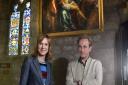 Fiona Bruce and Philip Mould in front of the cleaned painting before it was removed