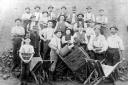Suffolk brickworkers pose for a photograph displaying some of their products.