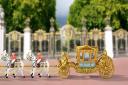 The tiny model is a 1:64 replica of the 261-year-old carriage which will carry the newly-crowned King and Queen Consort back in a grand procession to Buckingham Palace