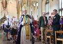 Bishop Philip wears a special cloak made during the 'Messy Installation' as he leads a procession of scores of Lancashire children around the cathedral. PHOTO: Clive Lawrence