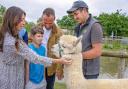 Liam White with a family of visitors at Fairytale Farm, near Chipping Norton.