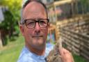 Terry Hayden at his Loddon home with one of his temporary charges, a rabbit the family is fostering for the RSPCA