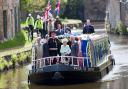 Lord Shuttleworth with the Queen, Prince Philip and Prince Charles travelling along the canal in Burnley in 2012