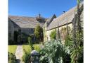 White Cliff Manor in Swanage, an eclectic walled garden terraced and divided into rooms by yew hedges