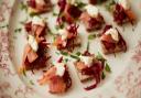 Rye bread squares topped with beetroot hash, horseradish cream and smoked salmon
