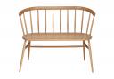 The Heritage Loveseat features a curved bench seat made from solid oak, a classic spindle back and neatly tapered legs