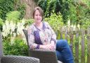 Romantic novelist Suzanne Snow in her garden at Hesketh Bank