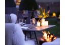 Enjoy a glass of wine by the fire with friends while dining outdoors at Heckfield Place