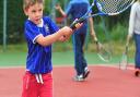 A young player tries his hand with a racket at last year's Great British Tennis Weekend at Beccles Tennis club