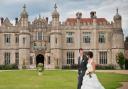 Amie and James Roller outside the stunning Hengrave Hall, on their wedding day. Picture by Sonya Duncan Photography