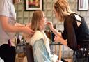 Getting ready for the shoot - The Cottage salon's Greg Churchill and Emily Hobbs prepare model Ieva Raustyte for her photos