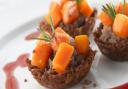 Chestnut and pumpkin seed croustade cups with butternut squash and cranberry jus