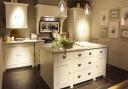 Neptune Chichester Kitchen with Lyra quartz worktop, Aga Total Control range cooker finished in Pearl Ashes, Shaftsbury pendant lighting, Wardley barstools, Accessories By Neptune By Hunters