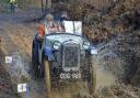 Grant Sellers and Henry Pearson, of Ashover, take the ‘Chez Perez’ watersplash in their 1936 Austin 7