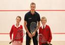 Champion squash player Nick Matthew with Giggleswick Junior School pupils