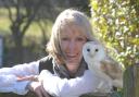 Pollyanna with a barn owl at her wildlife sanctuary, near Matlock