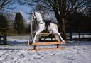 A beautiful winter white rocking horse 