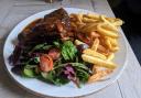 BBQ braised and glazed Swannington farm to fork pork ribs with fries and salad at The Carpenters Arms, Wighton. Picture: Rowan Mantell