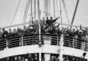 The HMT Empire Windrush with people from the Caribbean who answered Britain's call to help fill post-war labour shortages on arrival at the Port of Tilbury