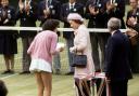 Queen Elizabeth II talking to Britain's Virginia Wade after presenting her with the trophy as Women's Singles Champion 1977