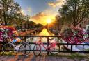 Sunrise on the famous UNESCO world heritage canals of Amsterdam