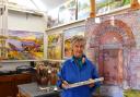 Susan Edwards in the studio working on a large painting of Kilpeck Church door, by Susan Edwards