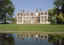 The south facade of the house with the pond in the foreground Credit: Historic England