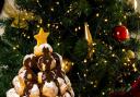 A snowy profiterole tower makes a Christmas centrepiece with the wow factor. Photo: Steve Adams