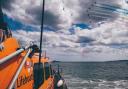 Scarborough lifeboat station's all-weather lifeboat, 'Frederick William Plaxton' with the Red Arrows roaring overhead. P