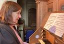 Beryl Berry, playing the organ.