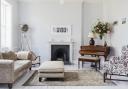 Traditional furniture blends with mid-century pieces to create rooms with interest