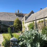 White Cliff Manor in Swanage, an eclectic walled garden terraced and divided into rooms by yew hedges