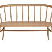 The Heritage Loveseat features a curved bench seat made from solid oak, a classic spindle back and neatly tapered legs