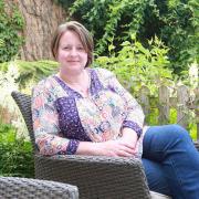 Romantic novelist Suzanne Snow in her garden at Hesketh Bank