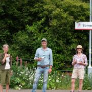 Conservation volunteers Sue Cox and Julie Reynolds with WildEast founder Hugh Crossley at Somerleyton station, part of Greater Anglia's scheme to adopt railway stations for wildlife.