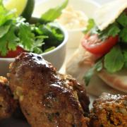 Lamb Kofta meal, served with gluten free naan and hummus, styled ready to eat.