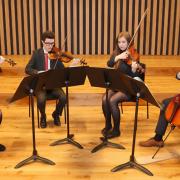 6th form string quartet students in The Stoller Hall at Chetham's School of Music