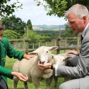Headmaster Richard Notman with pupil Ben Hooper and the school lambs